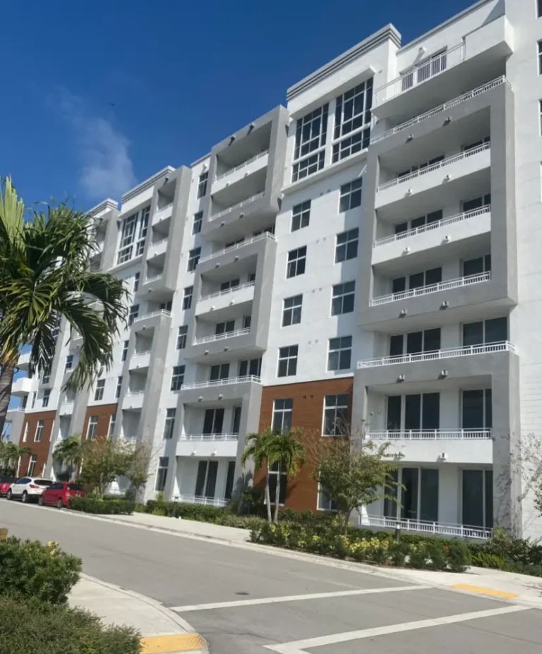 Licensed painting contractor in Miami FL reviewing a home exterior project — Gonzalez Painting Inc